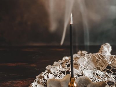 Close up of incense burning in a studio.